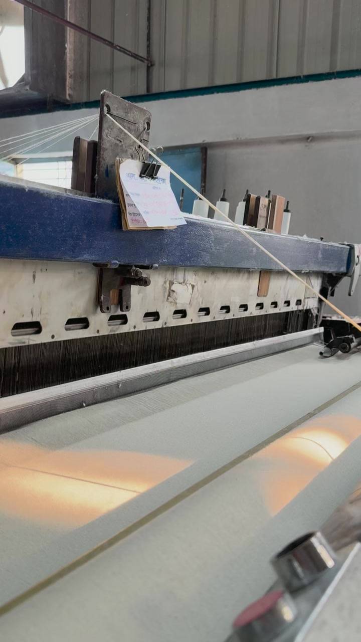 A Vamatex rapier loom weaving Greige Fabric at the Weaving Unit